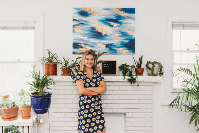 Check out my renter-friendly, affordable apartment makeover—from basic and beige to a bright, boho, modern space full of plants and DIYs! 