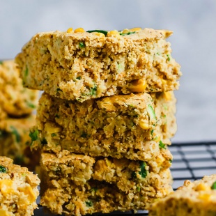 three squares of vegan cornbread stacked one on top of another