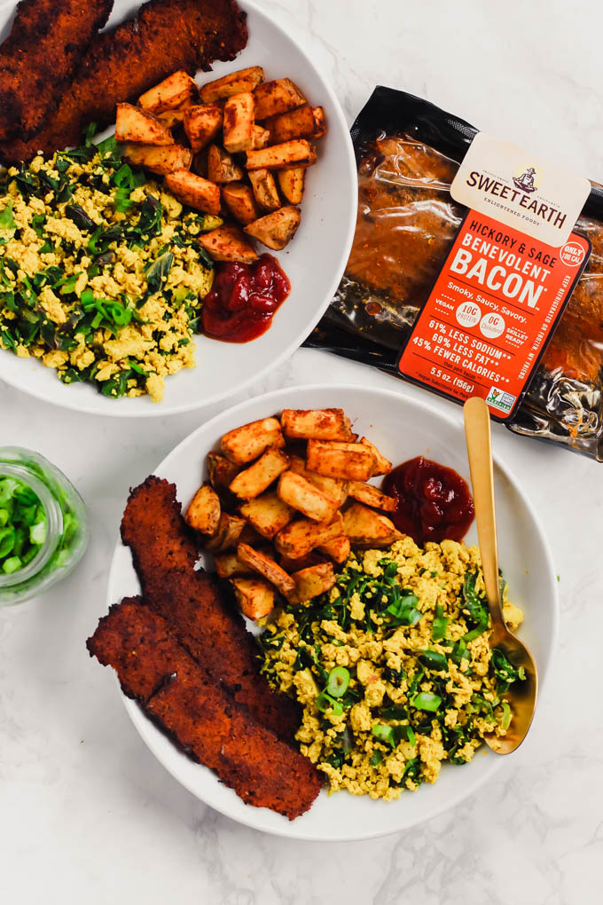 This loaded Vegan Breakfast Plate is the ultimate weekend brunch! It features eggy tofu scramble, veggie bacon, and crispy roasted potatoes.