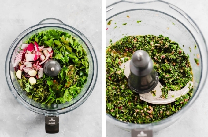 a food processor with carrot tops, parsley, cilantro, garlic and red onion