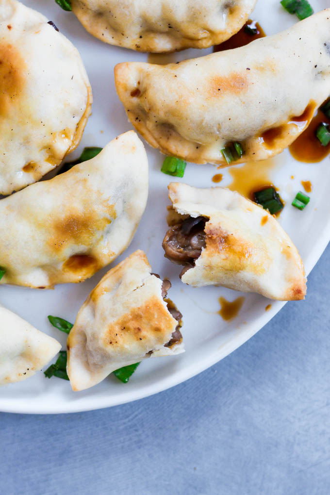 These Sticky Tempeh Potstickers are baked, not fried, and filled with a “meaty” mix of tempeh and vegetables. Serve as an entree or appetizer with soy sauce for dipping! (vegan)