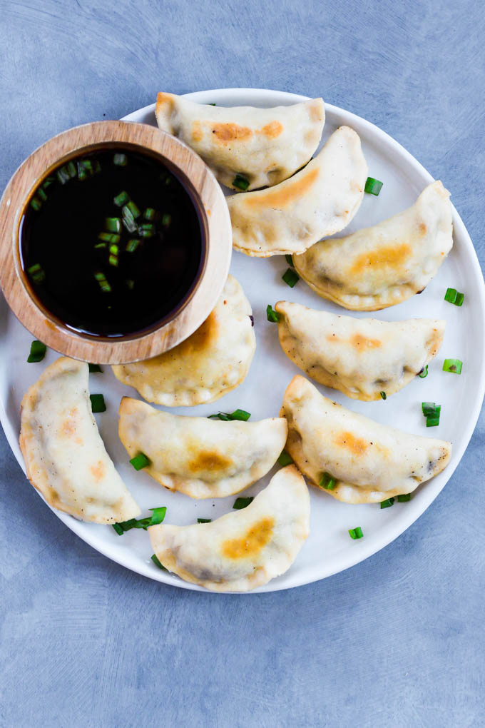 These Sticky Tempeh Potstickers are baked, not fried, and filled with a “meaty” mix of tempeh and vegetables. Serve as an entree or appetizer with soy sauce for dipping! (vegan)