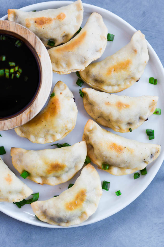 These Sticky Tempeh Potstickers are baked, not fried, and filled with a “meaty” mix of tempeh and vegetables. Serve as an entree or appetizer with soy sauce for dipping! (vegan)