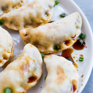 These Sticky Tempeh Potstickers are baked, not fried, and filled with a “meaty” mix of tempeh and vegetables. Serve as an entree or appetizer with soy sauce for dipping! (vegan)