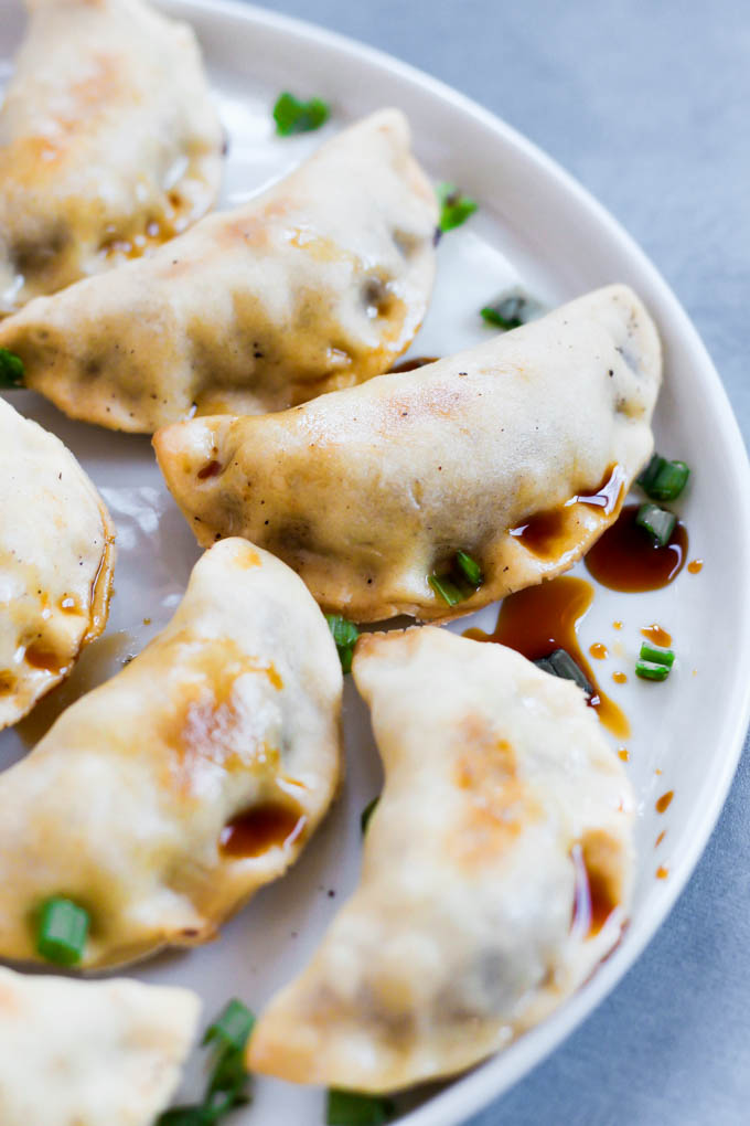 These Sticky Tempeh Potstickers are baked, not fried, and filled with a “meaty” mix of tempeh and vegetables. Serve as an entree or appetizer with soy sauce for dipping! (vegan)