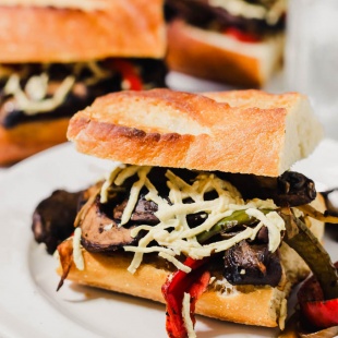 This Portobello Cheesesteak recipe will fulfill your comfort food cravings! These sandwiches are meaty (without meat) and feature gooey vegan mozzarella. They're sure to satisfy plant-eaters and carnivores alike!