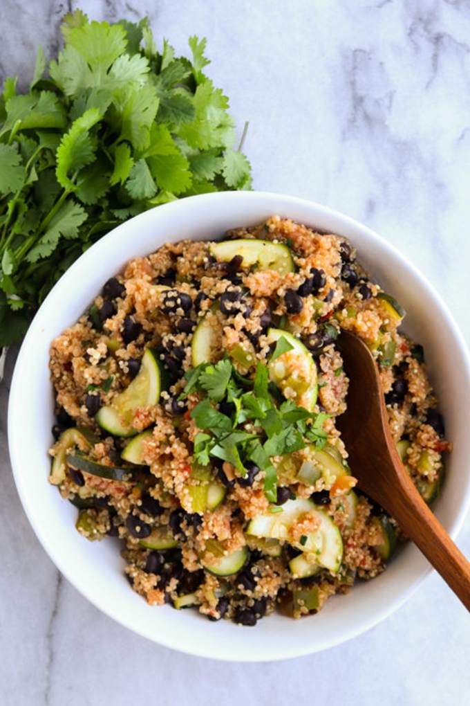 Vegan Mexican quinoa salad topped with cilantro