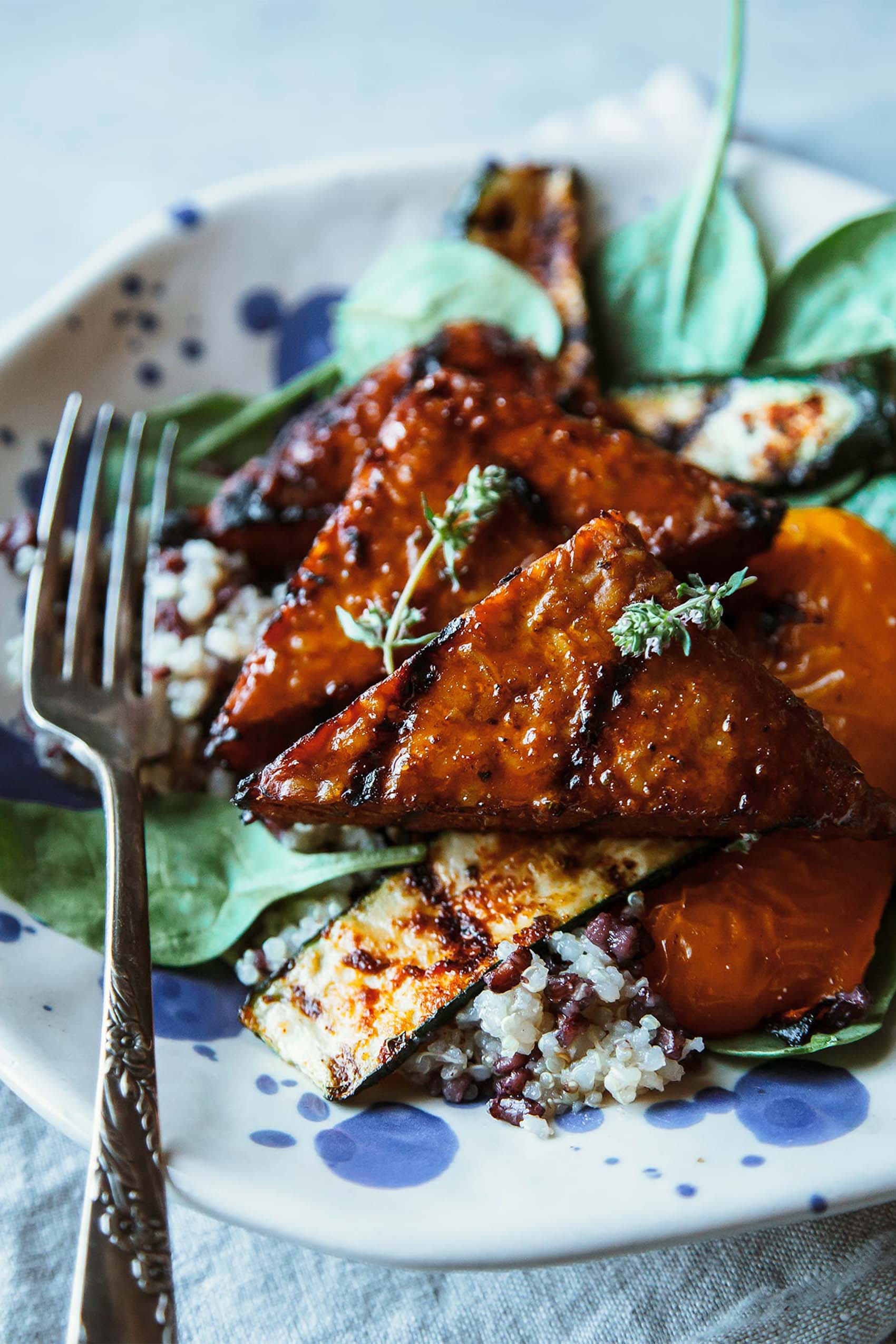 marinated, grilled tempeh served on a bed of greens