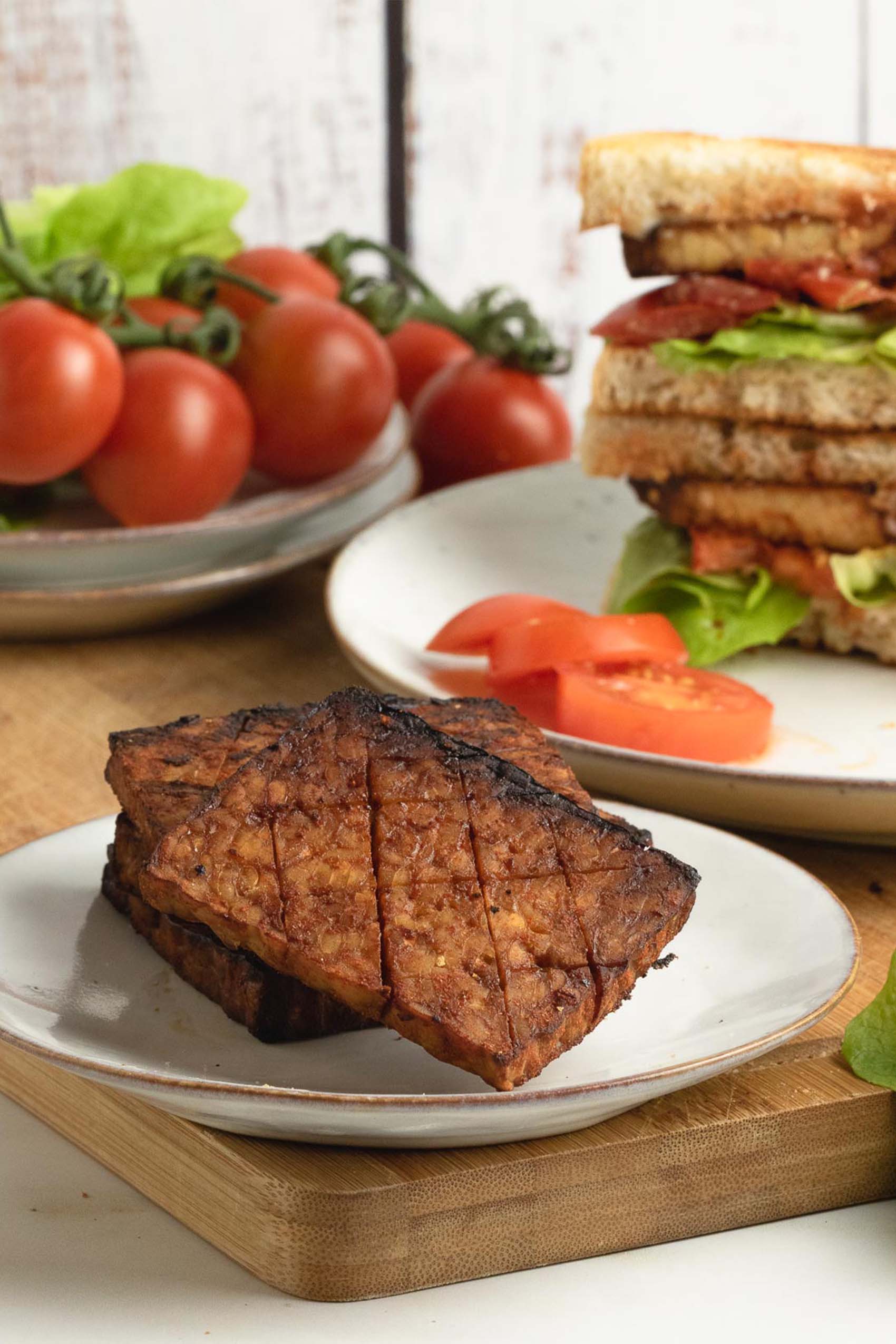 a plate of fried tempeh bacon