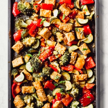 a sheet tray of cubed tempeh and vegetables
