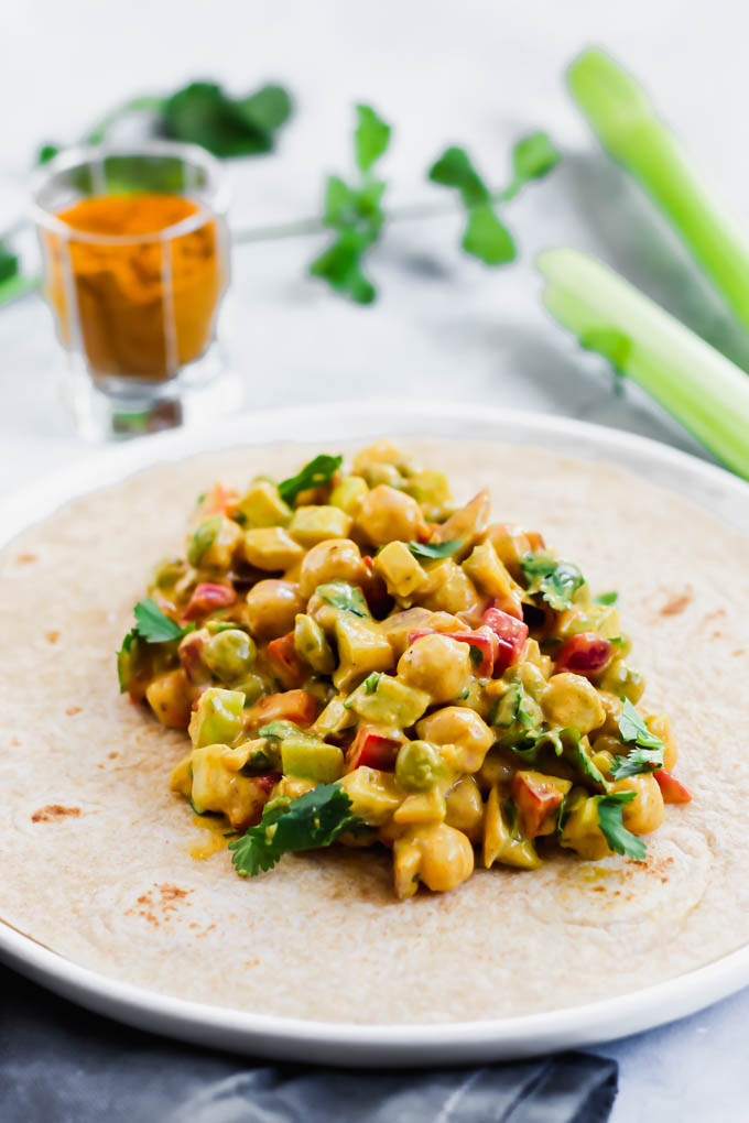 This Curried Chickpea Wrap is a simple, no-cook option for a quick lunch! Filled with beans, vegetables, & a creamy curry sauce, this wrap makes for a nutritious & satisfying meal.