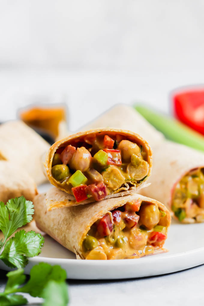 This Curried Chickpea Wrap is a simple, no-cook option for a quick lunch! Filled with beans, vegetables, & a creamy curry sauce, this wrap makes for a nutritious & satisfying meal.