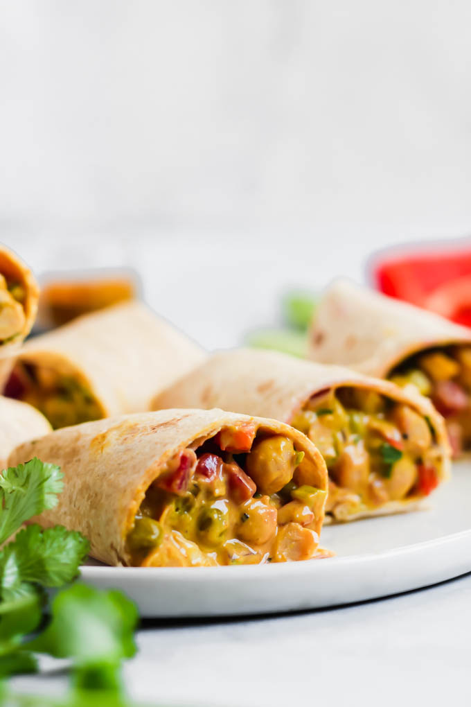 This Curried Chickpea Wrap is a simple, no-cook option for a quick lunch! Filled with beans, vegetables, & a creamy curry sauce, this wrap makes for a nutritious & satisfying meal.