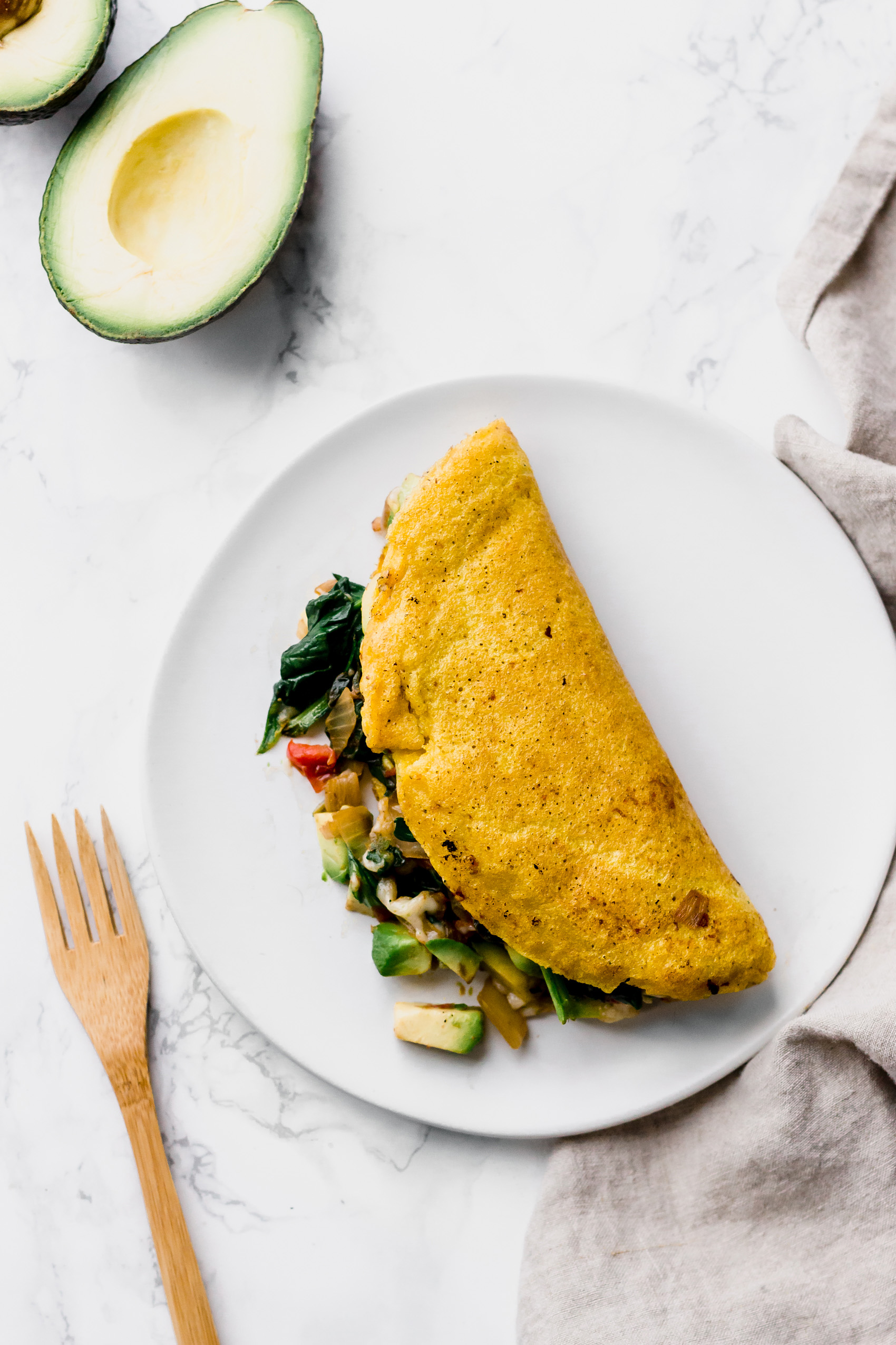 a vegan omelette stuffed with vegetables