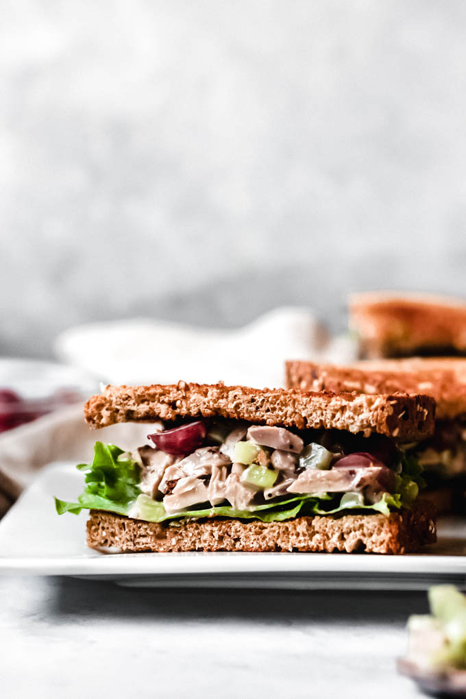 a half of a vegan chicken salad sandwich