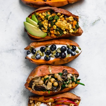 sweet potatoes stuffed with breakfast fillings like tofu scramble or berries and yogurt