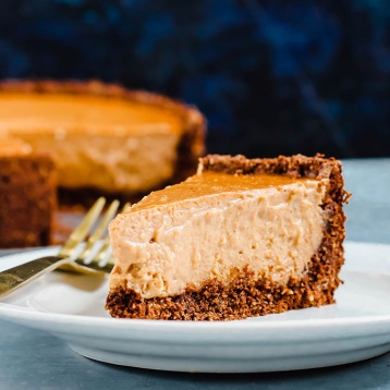 a slice of vegan pumpkin cheesecake