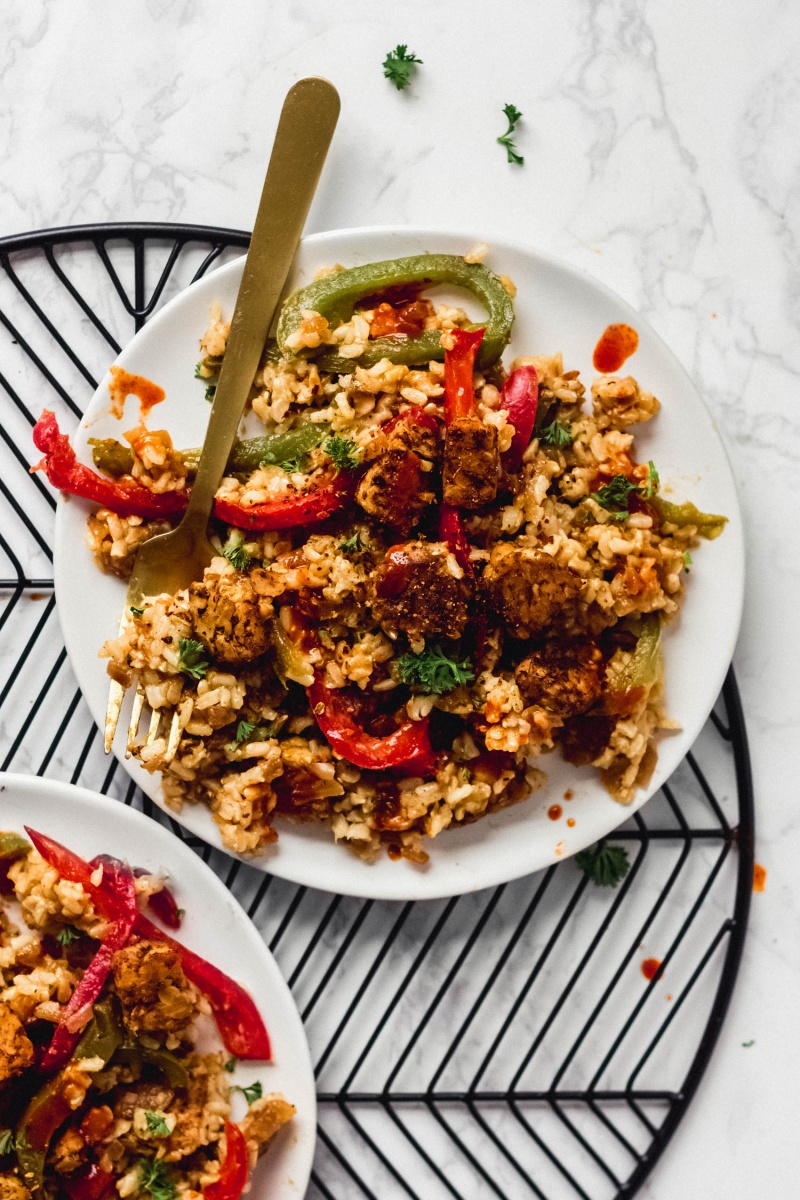 An overhead shot of a plate of cajun fried tempeh and rice