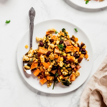 a plate of tofu scramble with sweet potatoes and black beans