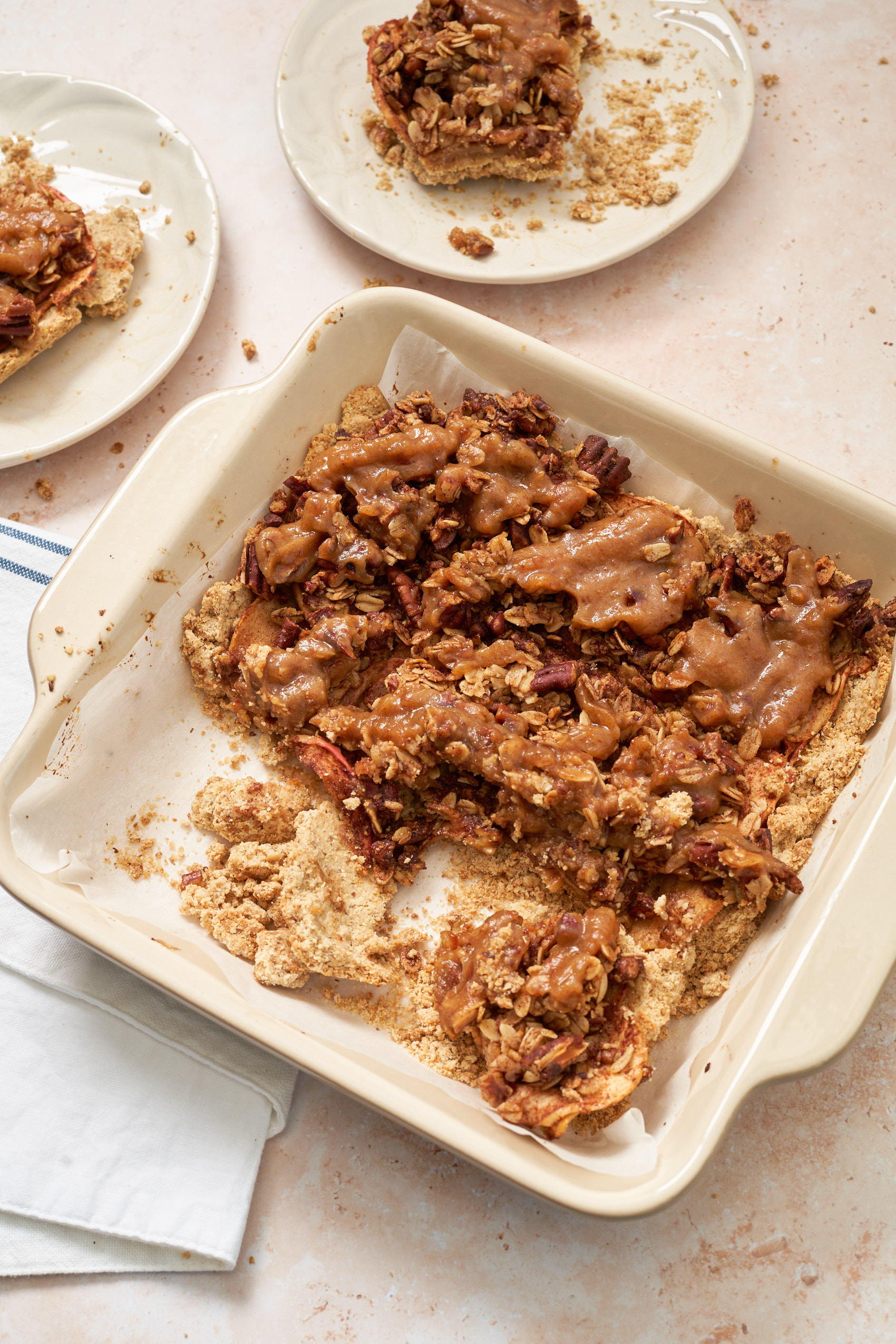 a dish of apple pie bars with a few servings that have been removed