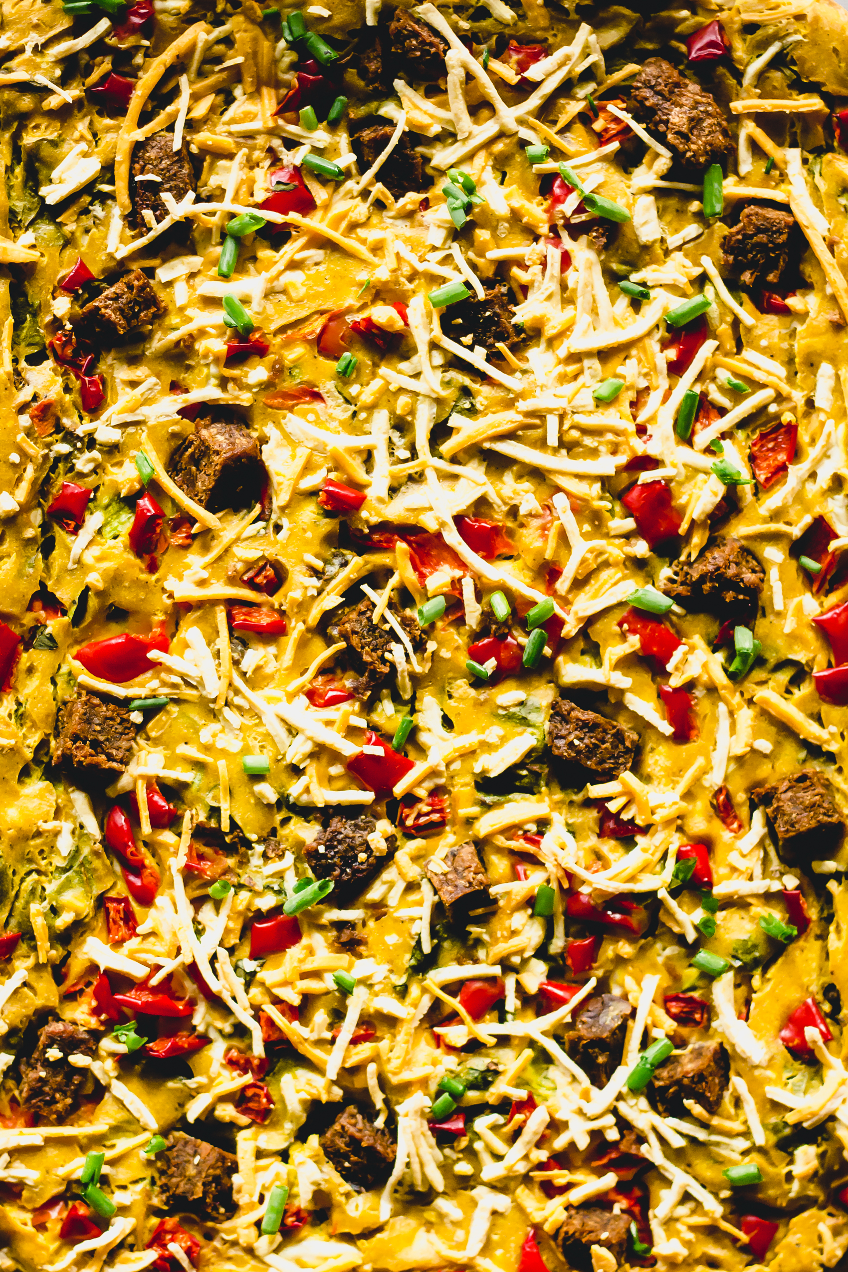 a close up of a casserole dish of baked vegan egg casserole