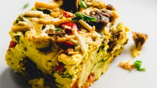 a slice of vegan breakfast casserole on a plate
