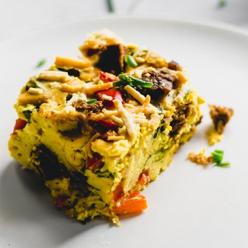 a slice of vegan breakfast casserole on a plate