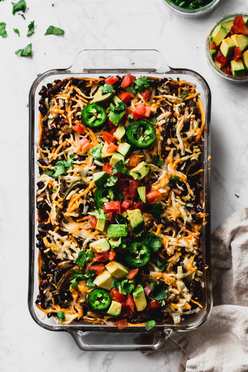 enchilada casserole with avocado and jalapeno