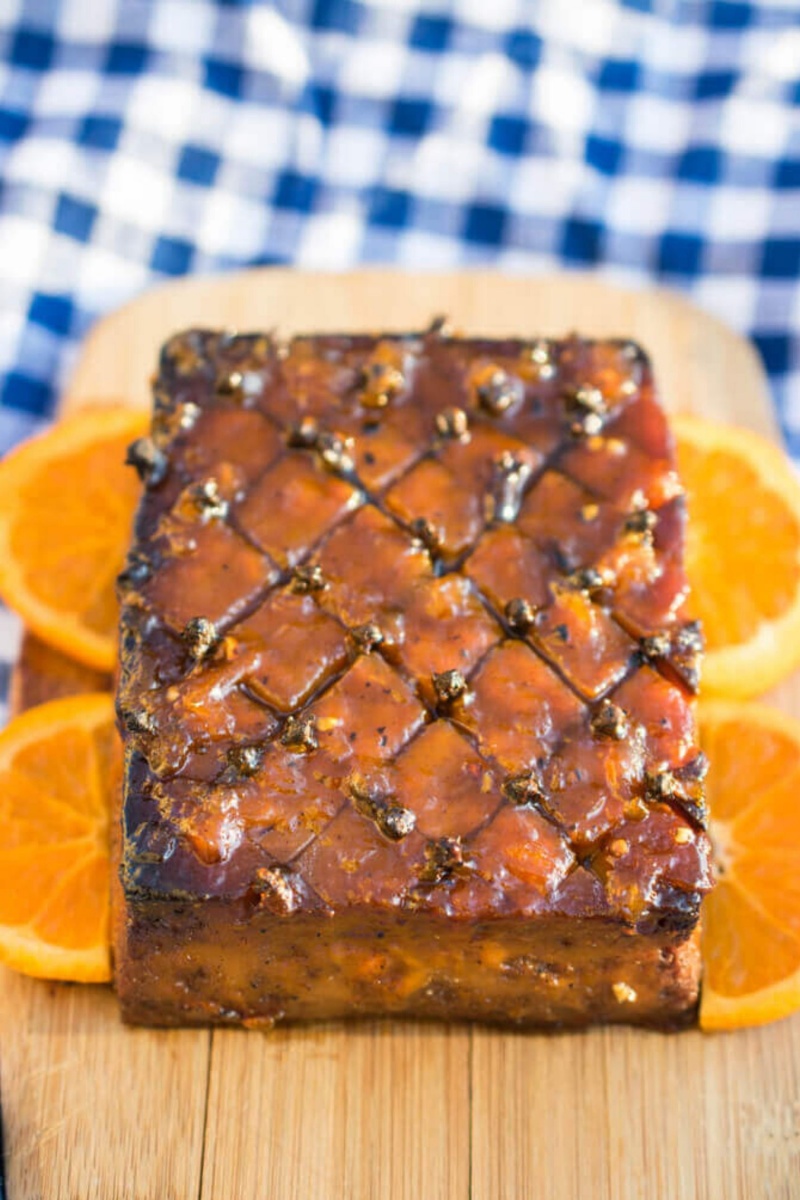 brick of glazed tofu on a wooden board 