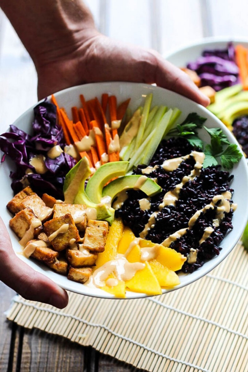 bowl of fresh vegetables with a drizzle 