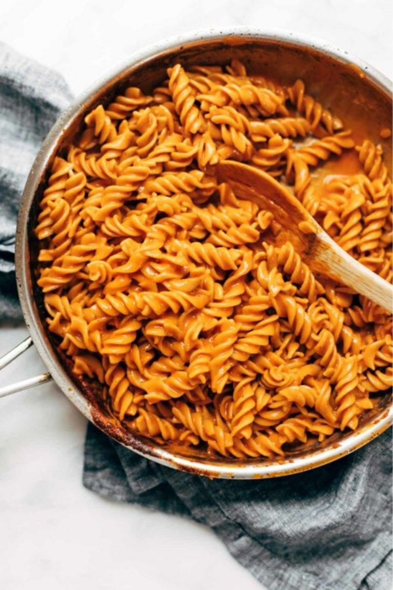 pasta in red sauce in a metal skillet