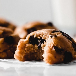 cookie dough ball with a bite taken out of it