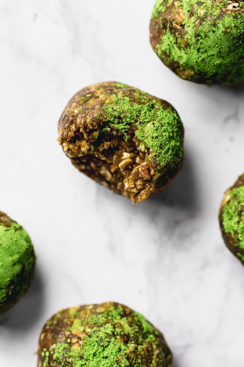 green matcha energy ball on a marble board