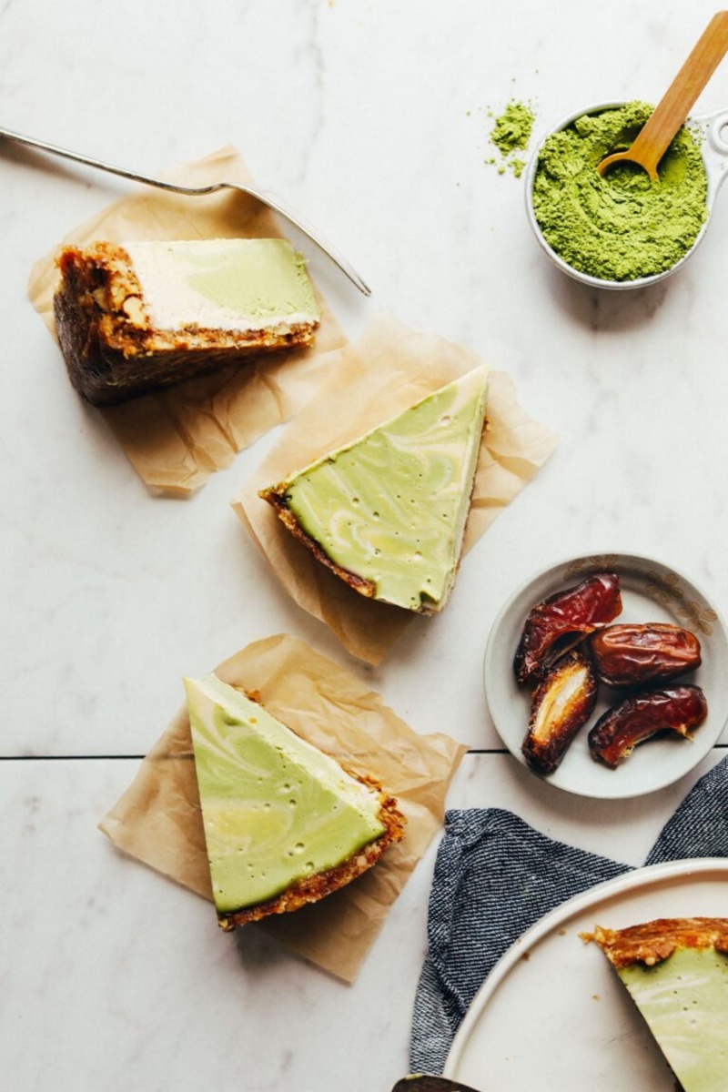 three slices of green cheesecake on parchment paper