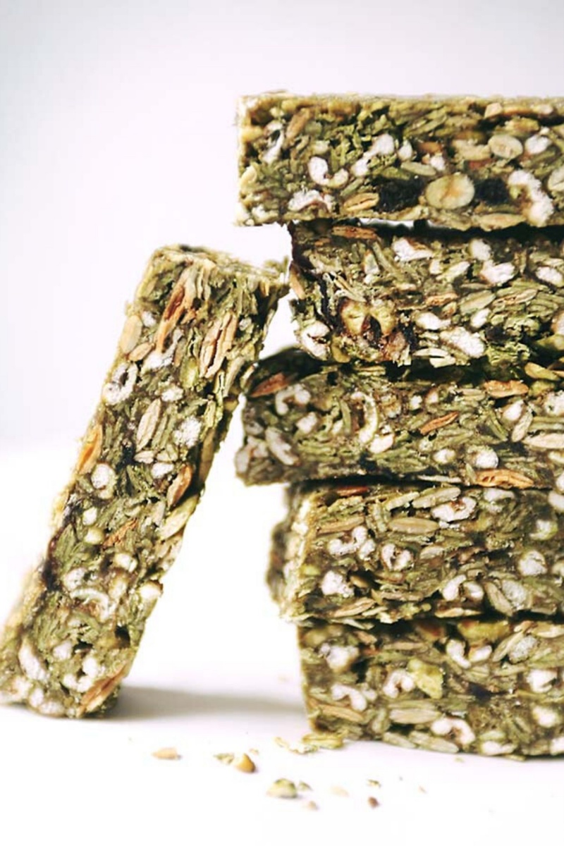 stack of five green matcha granola bars with one propped up on the side