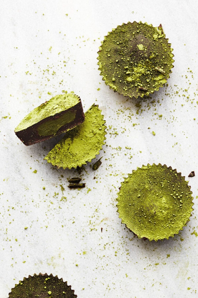 three green coconut butter cups with powdered topping 