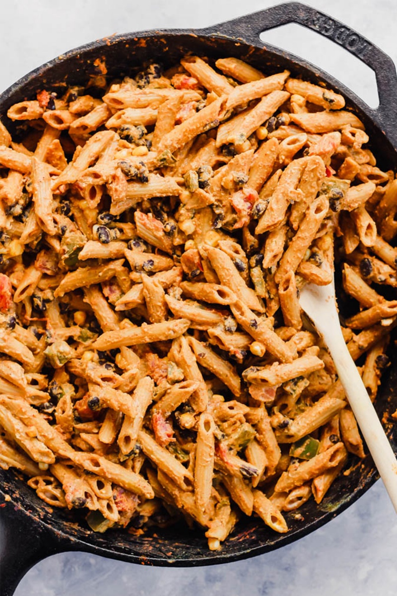 cast iron skillet with pantry meal of mexican pasta