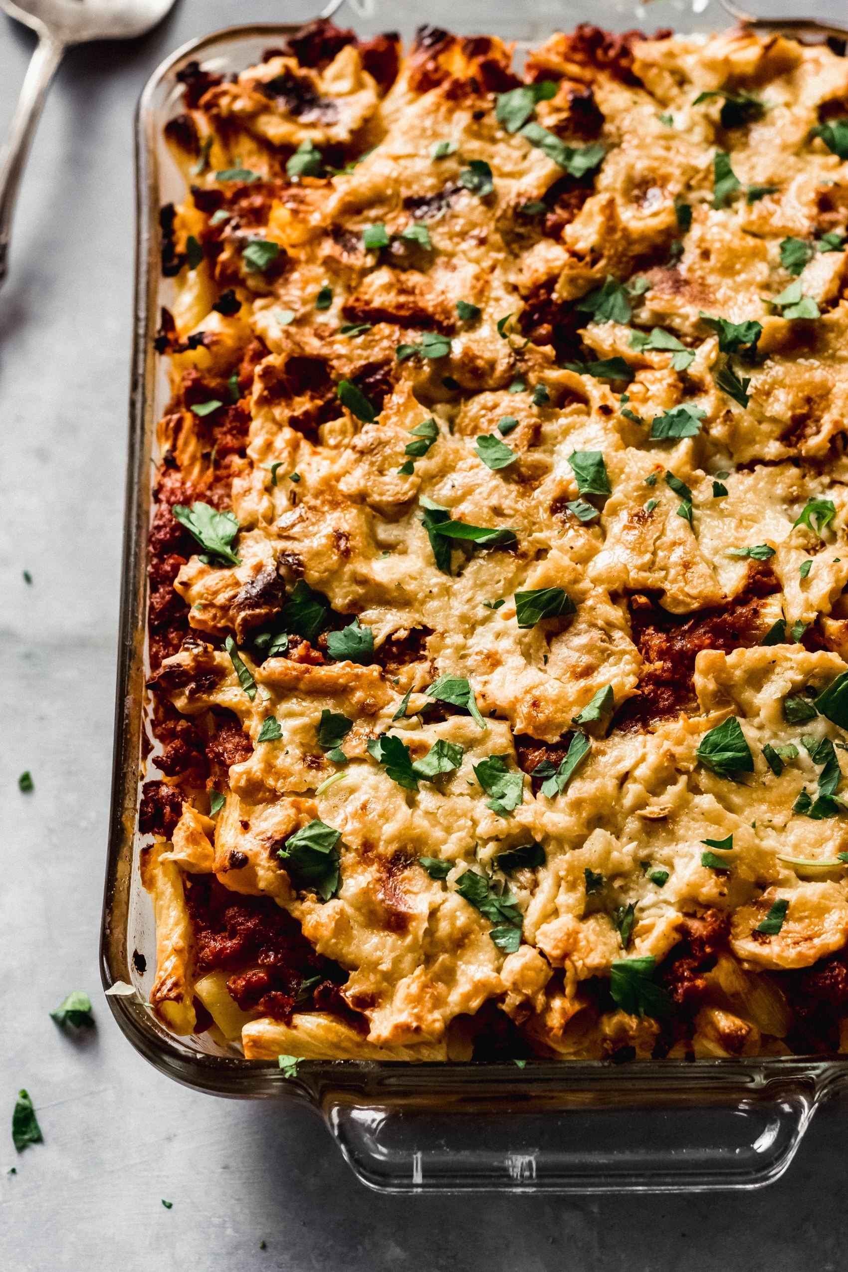 a baked ziti topped with fresh parsley