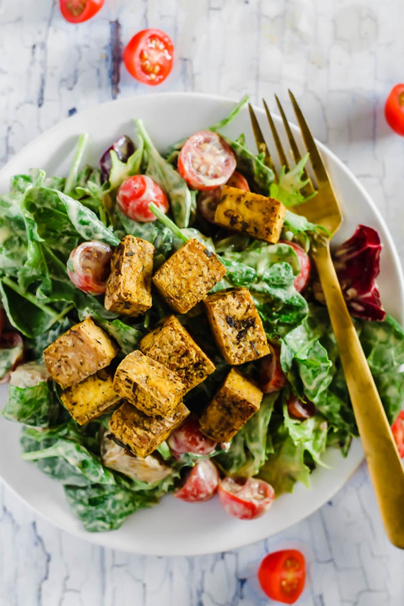 crispy tofu cubes on salad