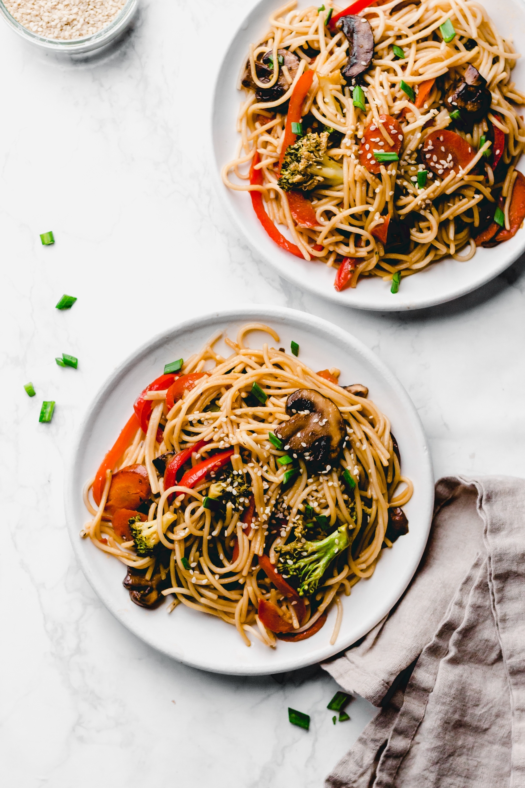 two plates of vegan veggie lo mein