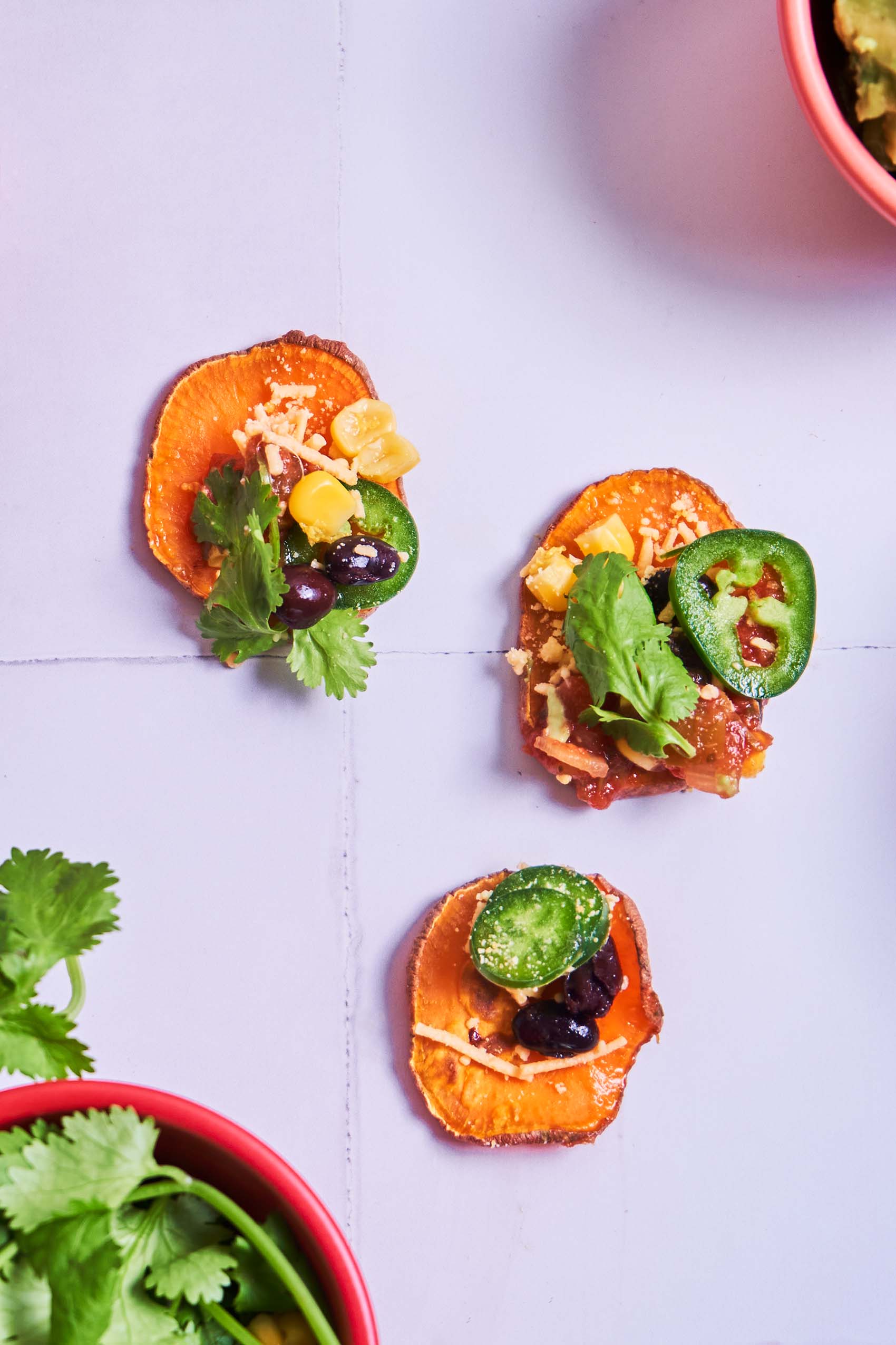 roasted sweet potato rounds topped with vegan nacho toppings