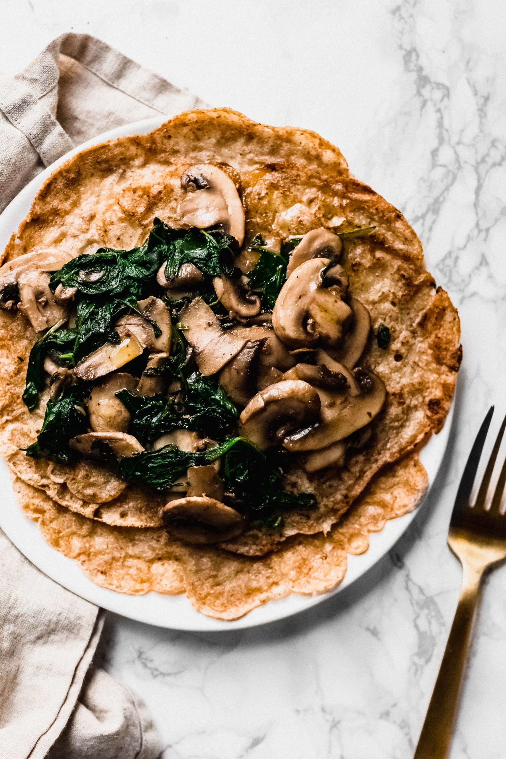 a close up of a mushroom crepe