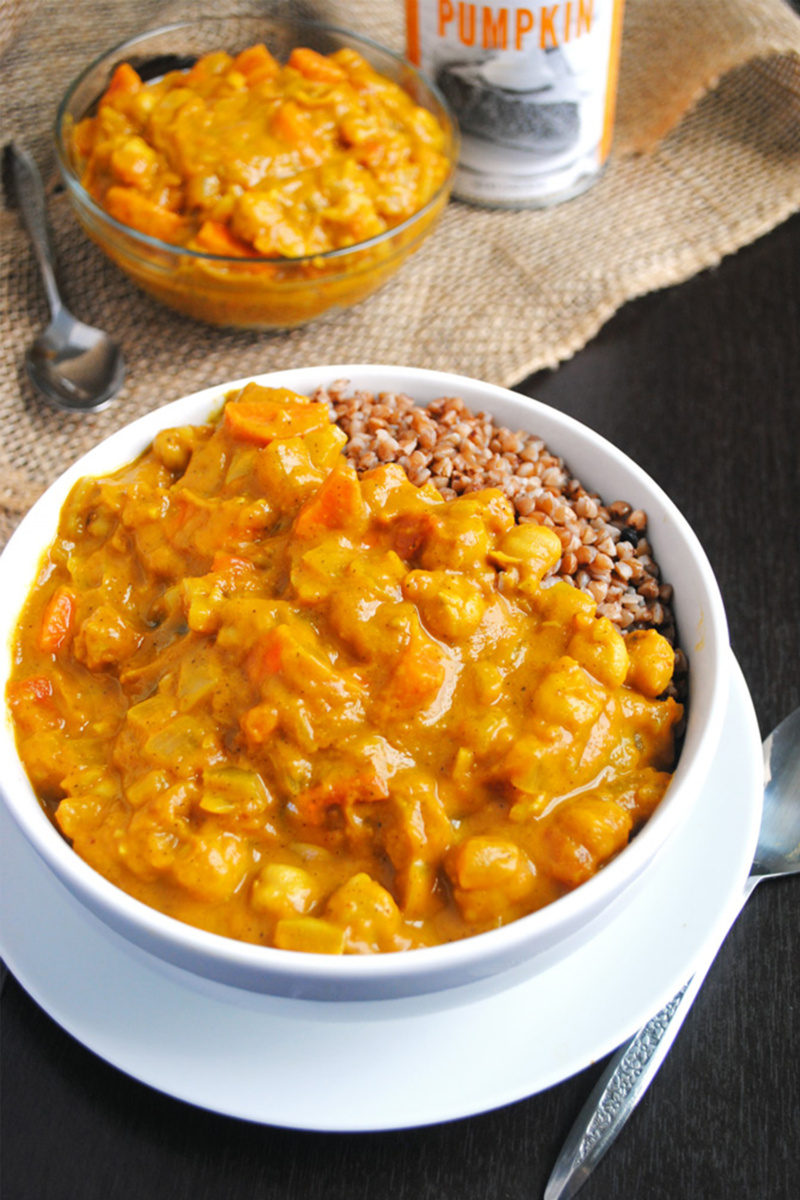 A bowl of chickpea and pumpkin coconut curry served with buckwheat groats