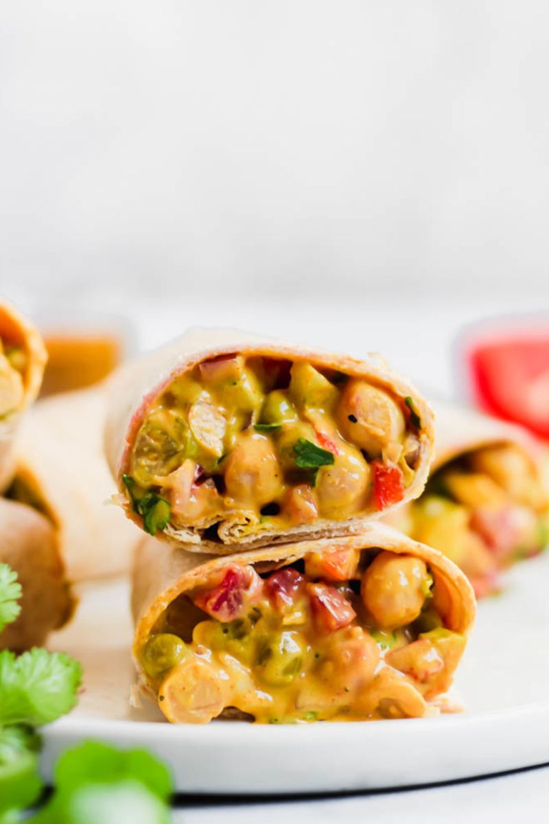 Two halves of a curried chickpea wrap stacked on top of one another