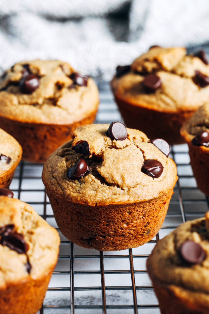 oatmeal banana chocolate chip muffins resting on a cooling rack