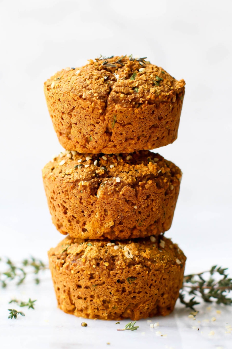 three sweet potato and herb muffins stacked on top of one another