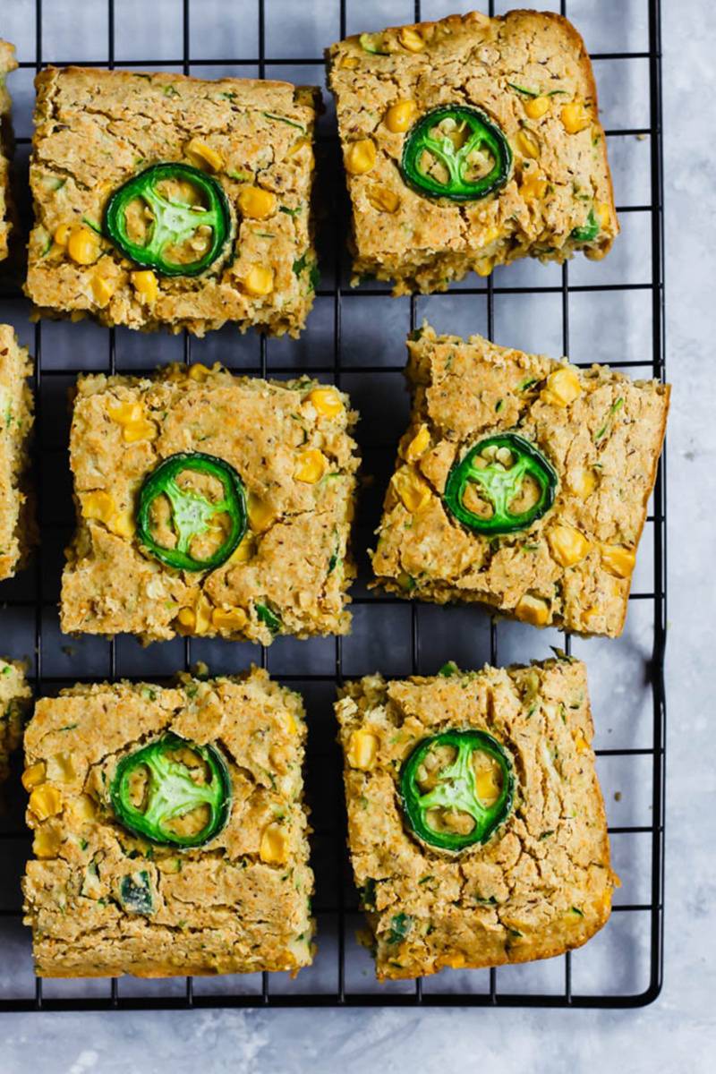vegan zucchini cornbread topped with slices of jalapeno