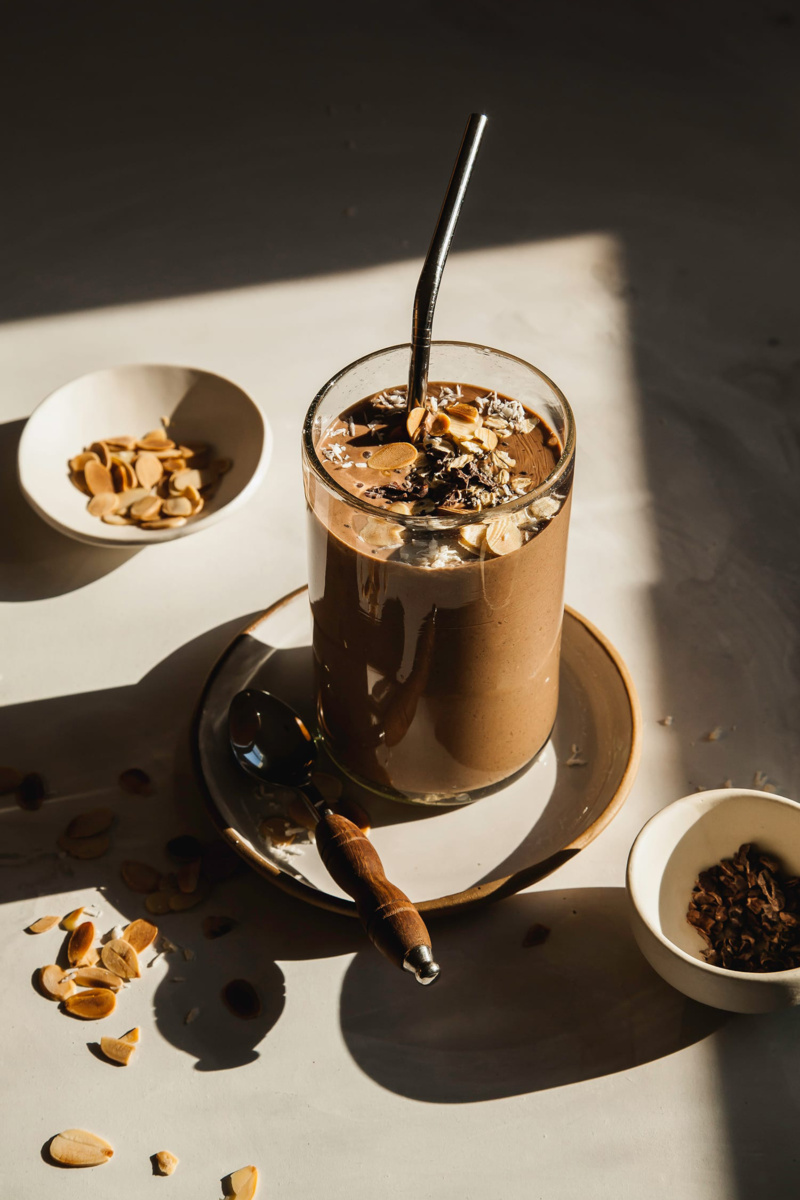 a chocolate smoothie topped with chopped almonds