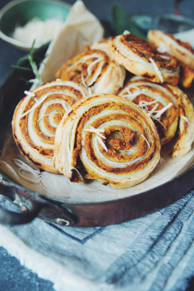 a pan filled with vegan cheesy pumpkin rolls