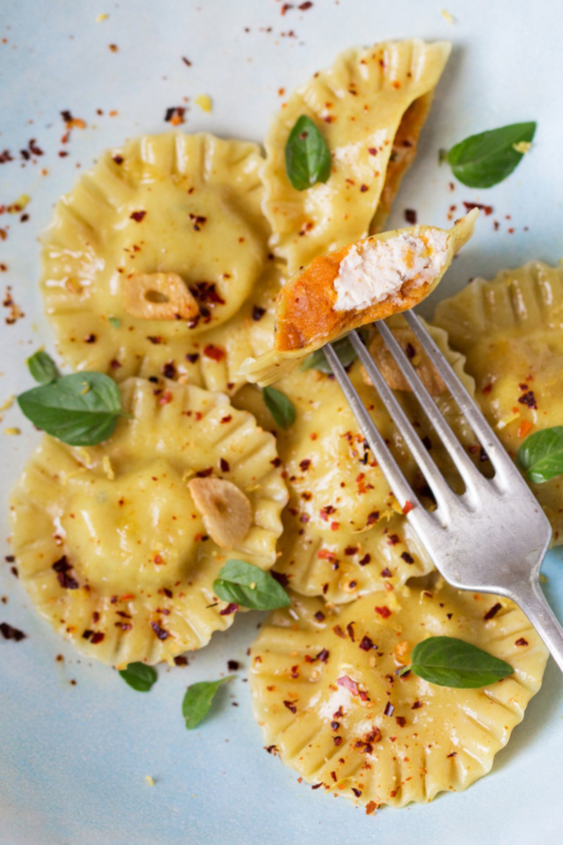 a plate of vegan pumpkin ricotta ravioli